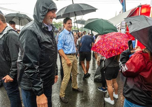 August 17, 2024, Toronto, On, Canada: Prime Minister Justin Trudeau greets people in the rain at the Taste of Manila festival in Toronto on Saturday, August 17, 2024. Toronto Canada  - ZUMAc35_ 20240817_zaf_c35_035 Copyright: xLauraxProctorx