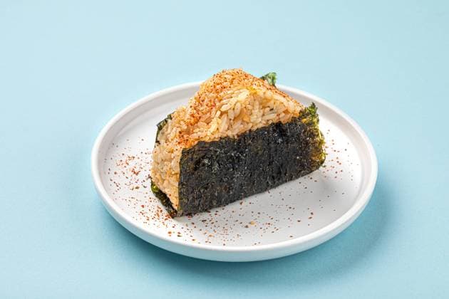 Portion of japanese onigiri snack with spices Portion of japanese onigiri snack with spices on a plate Copyright: xZoonar.com MaximxSparishx 21986598