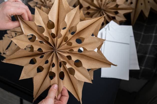 Process of preparing for Christmas star and New Year eve. 3D craft bag snowflakes DIY. Responsible ecological zero waste handmade decoration. Children hobby activity Process of preparing for Christmas star and New Year eve. 3D craft bag snowflakes DIY. Responsible ecological zero waste handmade decoration. Children hobby activity Home decor Copyright: xZoonar.com AnastasiiaxYanishevskax 22014834