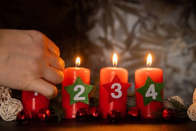 Four Advent red candles with numbers burning, fir branches and Christmas zero waste decorations in dark room in evening. Holiday preparation copy space for text. Catholic traditions of Christmas new year winter Four Advent red candles with numbers burning, fir branches and Christmas zero waste decorations in dark room in evening. Holiday preparation copy space for text. Catholic traditions of Christmas new year winter holidays Copyright: xZoonar.com AnastasiiaxYanishevskax 22061902