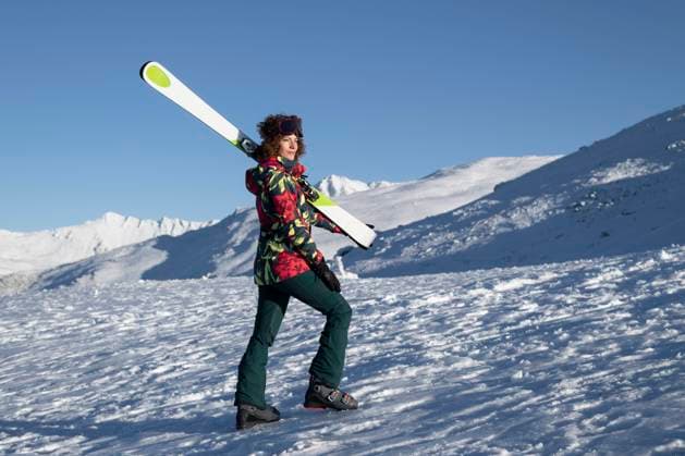 Woman holding ski pole and walking on mountain under blue sky model released, Symbolfoto, LMCF01402