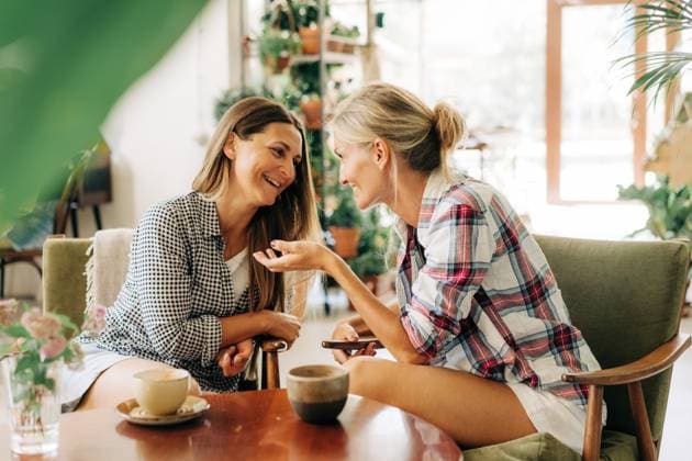 Two women are having a trust conversation while sitting in a restaurant. Two women are having a trust conversation while sitting in a restaurant. ,model released, Symbolfoto Copyright: xZoonar.com TITOVAxILONAx 22069502 ,model released, Symbolfoto ,property released