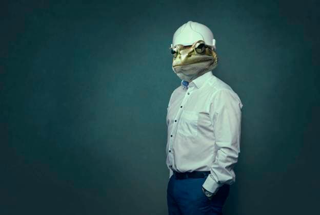 Creative Highlights Symbolbilder symbolic picture of an unfair competition in the business and empty promises, a businessman as a frog. model released, Symbolfoto, VTF00677