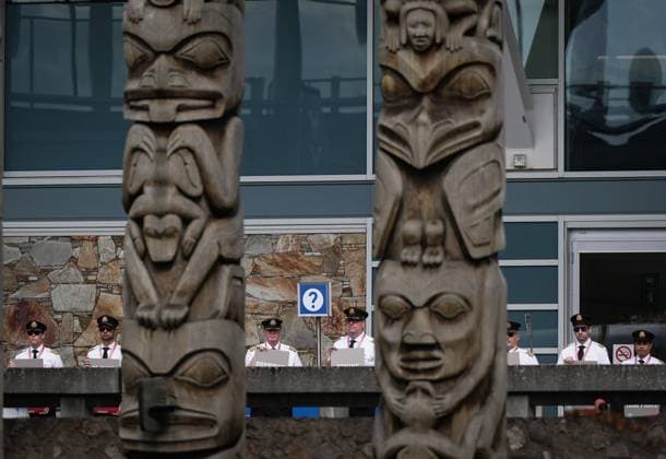 August 27, 2024, Richmond, Bc, CANADA: Air Canada pilots are seen behind totem poles while standing during an informational picket at Vancouver International Airport in Richmond, B.C., on Tuesday, August 27, 2024. Air Canada pilots voted overwhelmingly to approve a strike mandate last week, putting them in a position to walk off the job as early as Sept. 17. The Air Line Pilots Association, which represents more than 5,400 aviators at the country s largest carrier, said the vote passed with 98 per cent support. Richmond CANADA - ZUMAc35_ 20240827_zaf_c35_036 Copyright: xDarrylxDyckx