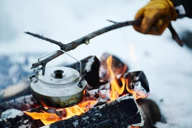 Kettle on stick over campfire , model released Copyright: xJohnerxImagesx , johner2502975.jpg 