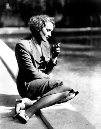 Actress Marlene Dietrich Sitting by Pool and Smoking, 1932  Copyright: xABxArchivex jtv007410
