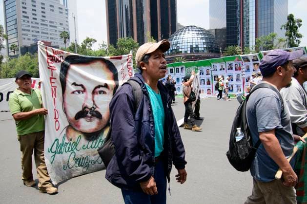 August 30, 2024, Mexico City, Mexico City, Mexico: Relatives of the disappeared and activists participate in the placement of photographs during the protests and a mass at the Paseo de la Reforma roundabout, in Mexico City..In Mexico, the Federal Government presented an update of the census of missing persons in which they reduce 20 thousand cases of the 114 thousand 815 reported by the national registry. Mexico City Mexico - ZUMAn296 20240830_zip_n296_001 Copyright: xJorgexNunezx