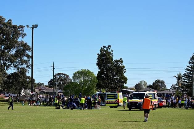 SYDNEY SOCCER DEATH, Paramedics try to resuscitate a man after he collapsed during the Granville Football Association Grand Final Day at Binalong Park, Toongabbie, NSW, Saturday, August 31, 2024. A man has died during a local soccer grand final, leading to the cancellation of other games as the community mourns. ( NO ARCHIVING, EDITORIAL USE ONLY, NO USE IN BOOKS WITHOUT CONSENT SYDNEY NEW SOUTH WALES AUSTRALIA Sydney  Copyright: xSTEVENxMARKHAMx 20240831164875186387