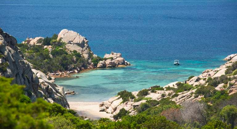 View from rocky hillside over the calm turquoise waters of Cala Napoletana, Caprera Island, La Maddalena Archipelago National Park, Sassari, Sardinia, Italy, Mediterranean, Europe Copyright: DavidxTomlinson 1310-391 RECORD DATE NOT STATED
