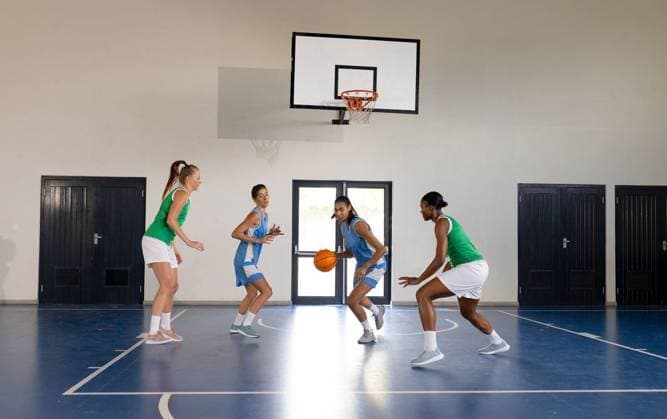 Playing basketball in school gym, female players competing in game Playing basketball in school gym, female players competing in game. Sports, competition, athletes, teamwork, gymnasium, fitness, model released, , property released, Cape Town, South Africa, 2024-03-27T22:00:00.000Z, 5318586.jpg, people,playing,basketball,school,gym,female,players,competing,game,sports,competition,athletes,teamwork,gymnasium,fitness,exercise,training,performance,activity,match,league,unaltered,score,court,dribble,shoot,rebound,strategy,agility,endurance,strength,youth,schoolgirls,uniforms,sneakers,sportswear,determination,rivalry,collaboration,sportsmanship,coaching,drills,skills,energy,motivation,health,wellness,fun,recreation,play,tournament Young Adult,W