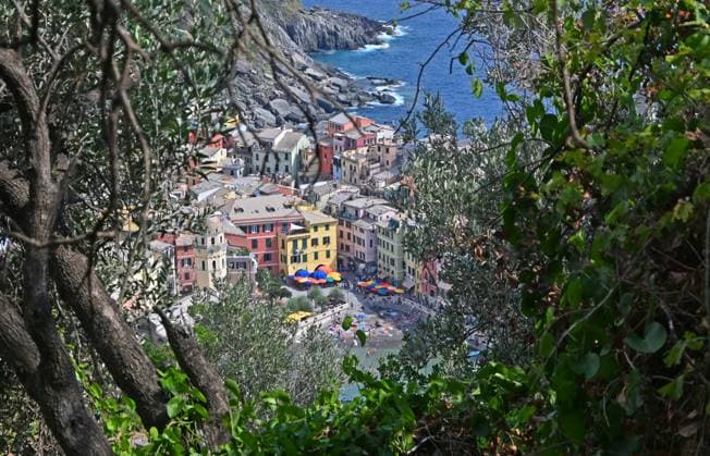 August 3, 2024, New York, New York, USA: Travel and vacations have become all about taking cellphone photos to share on social media and checking certain destinations off the bucket lists that have become crowded due to over tourism. Cinque Terre along the cost of Liguria in Italy, has become one of the top travel bucket list locations. This has led to over full ferries and crowded beaches. Vernazza is another popular stop.. (Photo: Andrea RENAULT Zuma Press) New York USA - ZUMAg115 20240803_faf_g115_023 Copyright: xAndreaxRenaultx