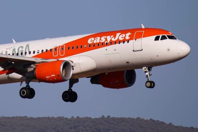 EasyJet Airbus A320 Landing EasyJet Airbus A320 passenger aircraft spotted flying on final approach for landing at the runway of Athens International Airport ATH at the Greek capital. The A320 airplane of easyJet Europe has the registration tail number OE-IJW, is powered by 2x CFMI jet engines and is painted in Malaga livery special colours. EasyJet is a British multinational low-cost airline carrier group with headquarters in London while EasyJet Europe Airline GmbH is a subsidiary, a European budget airline based in Vienna, Austria. The airline group operates an all Airbus A320 family fleet including the NEO planes. Athens, Greece on July 2024 Athens Greece  Copyright: xNicolasxEconomoux originalFilename: oikonomou-notitle240719_npi3D.jpg