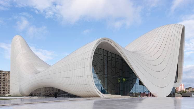 Modern Architecture of Heydar Aliyev Centre in Baku Azerbaijan on a sunny summer Day The iconic Heydar Aliyev Centre in Baku, Azerbaijan, showcases modern architecture with its fluid, wave-like design against a clear sky. Building designed by the deceased architect Zaha Hadid Copyright: xZoonar.com KHALEDxELADAWYx 22082927