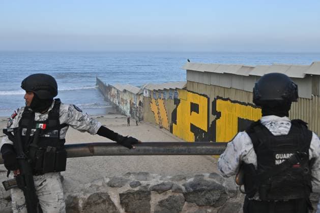 September 6, 2024, Tijuana, Baja California, Mexico: Members of the Mexican National Guard patrol near a new interactive mural of deported veterans at the Playas de Tijuana beach border wall, The Deported Veterans Diaspora on the Tijuana, Mexico side of the US-Mexico Border on Friday, September 06, 2024. This mural is part of a larger project by Lizbeth De La Cruz Santana, an assistant professor in the department of Black and Latino Studies at Baruch College in New York City, in collaboration with Humanizing Deportation, to document and make visible the stories of deported people. The mural installation in Tijuana is the third in a series that seeks to show the faces and experiences of deportees. Two additional murals are scheduled to o - ZUMAm180 20240906_zip_m180_004 Copyright: xCarlosxA.xMorenox