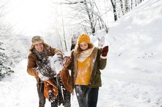 Friends in snowball fight in snowy nature. First snowfall of the season. Friends in snowball fight in snowy nature. First snow of the season model released