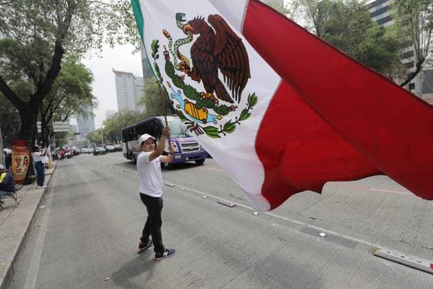 A Judiciary worker waves a Mexican flag while taking part during a rally against the Judicial Reform proposed by current President Andres Manuel Lopez Obrador outside the facilities of the Mexican Senate. Deputies are expected to meet tomorrow to discuss the Judicial Reform. on September 9, 2024 in Mexico City, Mexico. Mexico City Mexico - ZUMAe321 20240909_zia_e321_004 Copyright: xIanxRoblesx