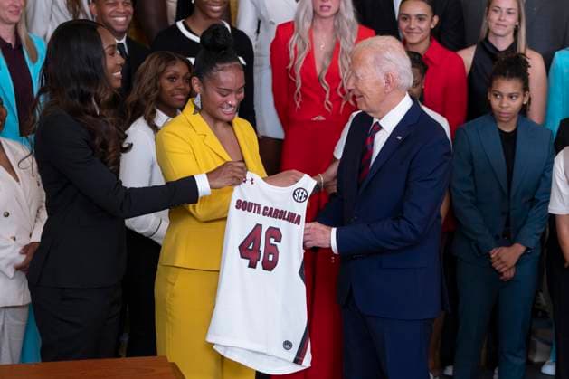 September 10, 2024, Washington, District Of Columbia, USA: United States President Joe Biden receives a team jersey from Bree Hall and Te-Hina Paopao at a celebration for the University of South Carolina Gamecocks Women™s Basketball Team at the White House in Washington, DC to celebrate their 2023-2024 NCAA championship season at the September 10, 2024 Washington USA - ZUMAs152 20240910_faa_s152_103 Copyright: xChrisxKleponisx