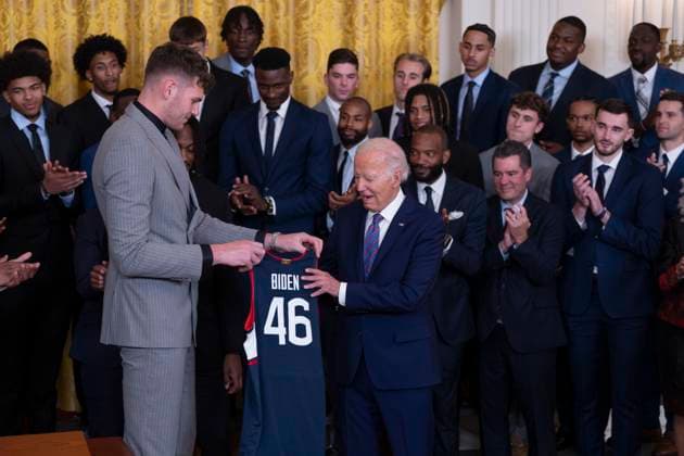 September 10, 2024, Washington, District Of Columbia, USA: United States President Joe Biden receives a team jersey from the Center Donovan Clingan during a celebration at the White House in Washington, DC celebrating the University of Connecticut Huskies Men™s Basketball Team™s 2023-2024 NCAA championship season, September 10, 2024 Washington USA - ZUMAs152 20240910_faa_s152_117 Copyright: xChrisxKleponisx