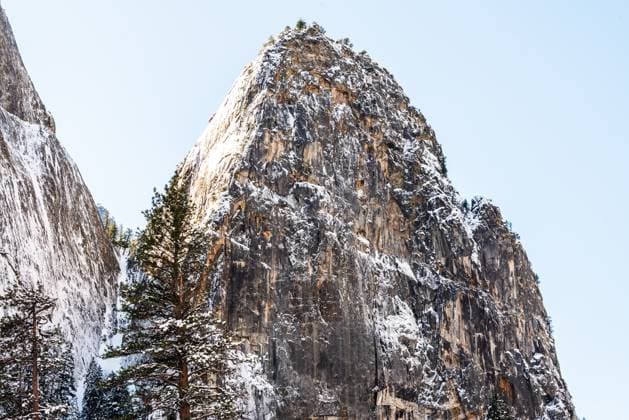 Creative Highlights World Snow-covered granite peak rises against a clear sky in Yosemite Yosemite Valley, California, United States R_OCZQ240909-1526899-01