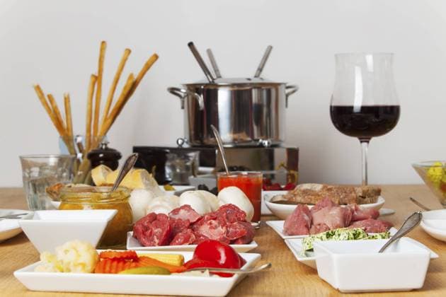 Fondue set on a table Copyright: imageBROKER Photographer:xBernd ibxiqx10787665.jpg