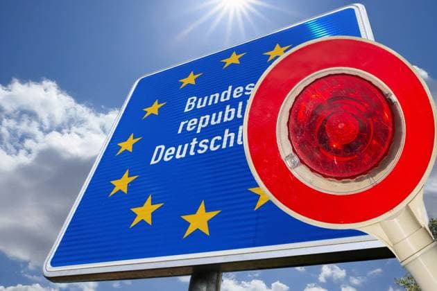 Symbolbild Asyldebatte: Haltekelle vor einem Grenzschild der Bundesrepublik Deutschland (Composing) *** Symbolic image Asylum debate Trowel in front of a border sign of the Federal Republic of Germany Composing Copyright: xUdoxHerrmannx