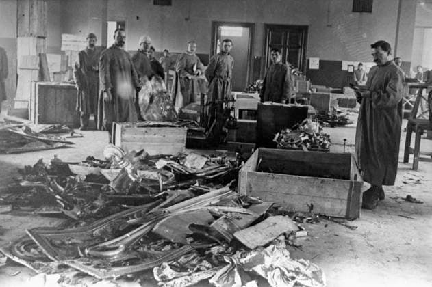 Confiscating valuable church items in 1922 8762909 26.02.1922 Confiscating valuable church items in 1922. In February 1922, the All-Russian Central Executive Committee, an early Soviet parliament, issued a decree on the confiscation of valuable church items for saving famine victims in the Volga River area. Photo: Members of a commission to record and stockpile confiscated valuable church items at work. Russia  Copyright: xx