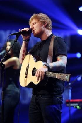 Ed Sheeran Live in Copenhagen. Photo. Ed Sheeran Edward Christopher Ed Sheeran (born 17 February 1991) is an English singer-songwriter and guitarist. He also writes and produces songs on his own and created his label, Paw Print Records. 2 Sheeran is recognized for doing pop music. He was born in Halifax, West Yorkshire. As a child, he lived in Framlingham, Suffolk. Sheeran is set to release his third studio album, Ëœ ( divide ), on 3 March 2017. He released the two singles Shape of You and Castle on the Hill in January 2017. Shape of You became his first number-one hit on the Billboard Hot 100 when it entered at the top of the chart. The song has reached number one in several countries around the world, and Castle on the Hill Copyright: xHenrikxHildebrandt Famousx acwaz097