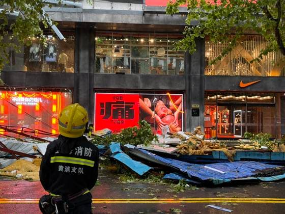 Bilder des Jahres 2024, News 09 September News Themen der Woche KW38 News Bilder des Tages China Shanghai Typhoon Bebinca A fireman looks at the sidewalk damaged by the typhoon in Shanghai, China Monday, Sept. 16, 2024. Typhoon Bebinca, the most powerful typhoon to hit the metropolis in 75 years, has landed in Shanghai Monday morning. The big character in the advert reads Hurted ., Credit:FEATURECHINA Avalon CHINA, SHANGHAI  Copyright: xFEATURECHINAx xAvalonx 0908104323