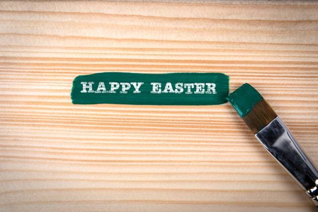 Happy Easter. Green paint and brush on wood texture background. Copyright: xEdgarsxSermulisx