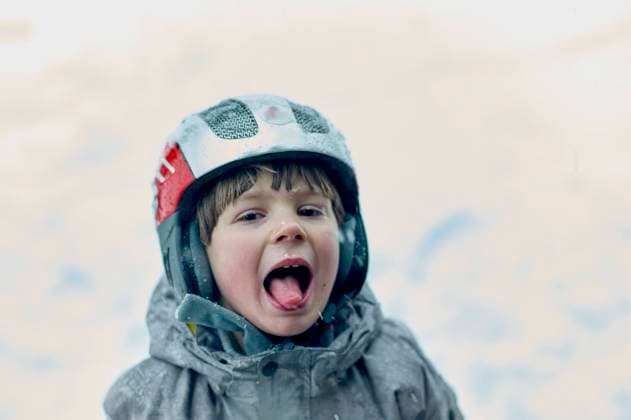 Creative Highlights Symbolfotos Cheerful young boy in a helmet and raincoat yelling with a joyful expression. bola03111 Copyright: xConnectxImagesx ,model released