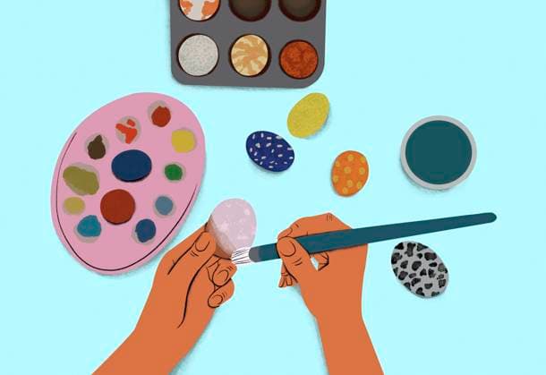 Hands painting Easter eggs with vibrant watercolors, showcasing creativity. Easter, Craftsmanship, Tradition, Vibrance, Festivity A pair of hands painting a colorful egg against a light blue background, with a palette and paintbrushes nearby. sham00275 Copyright: xConnectxImagesx ,property released