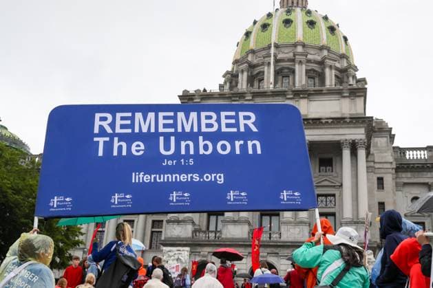 4th Annual Pennsylvania March for Life in Harrisburg, USA - 23 Sept 2024 Members of the Liferunners organization hold a large banner in front of the Pennsylvania State Capitol during the Pennsylvania March for Life. Hundreds of abortion opponents gathered at the Pennsylvania Capitol for the fourth annual Pennsylvania March for Life. Harrisburg United States Copyright: xPaulxWeaverx xSOPAxImagesx PWeaver-240923-017