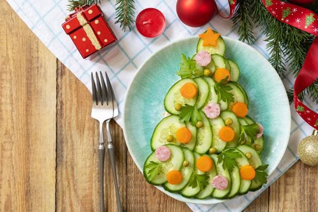 New year meal idea Christmas tree from a salad olivier on a rustic table. New year meal idea Christmas tree from a salad olivier on a rustic table. Christmas creative appetizer salad like a christmas tree with festive decoration. View from above. Copy space. Copyright: xZoonar.com ELENAxHRAMOVAx 22238627