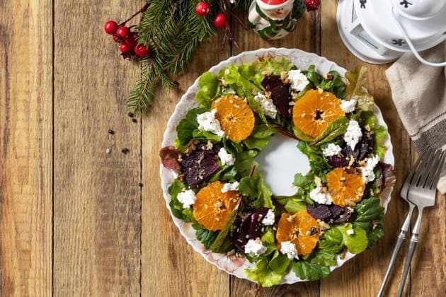Christmas appetizer New year meal idea. Christmas wreath salad with beetroot, tangerines, feta cheese and pecans on the rustic table. Christmas appetizer New year meal idea. Christmas wreath salad with beetroot, tangerines, feta cheese and pecans on the rustic table. View from above. Copy space. Copyright: xZoonar.com ELENAxHRAMOVAx 22238655