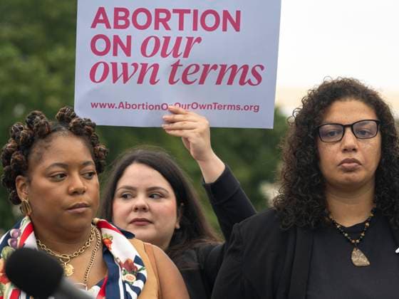 September 24, 2024, Washington, District Of Columbia, USA: A sign reading Ã’Abortion on our own termsO is displayed at an event announcing the introduction of a Congressional resolution affirming reproductive freedom as a human right. KWAJELYN JACKSON (lower left) Executive Director of Atlantas Feminist Womens Health Center, spoke on the importance of reproductive justice for all, especially those with limited access to health care. Washington USA - ZUMAd155 20240924_znp_d155_011 Copyright: xSuexDorfmanx