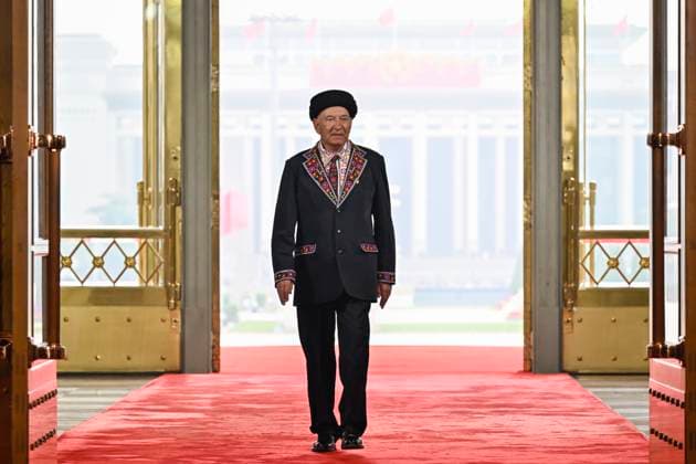 (240929) -- BEIJING, Sept. 29, 2024 -- Bayika Kalidibek, a recipient of the title of People s Guard, arrives at the Great Hall of the People in Beijing, capital of China, Sept. 29, 2024. China held a high-profile ceremony on Sunday morning to award the highest state honors ahead of the 75th founding anniversary of the People s Republic of China. ) (FOCUS)CHINA-BEIJING-HIGHEST STATE HONORS-CEREMONY (CN) YinxBogu 