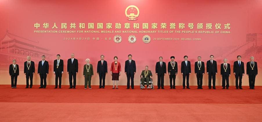 (240929) -- BEIJING, Sept. 29, 2024 -- Chinese President Xi Jinping, also general secretary of the Communist Party of China (CPC) Central Committee and chairman of the Central Military Commission, and other leaders have group photos taken with the recipients of national medals and national honorary titles of the People s Republic of China in Beijing, capital of China, Sept. 29, 2024. A presentation ceremony for national medals and national honorary titles of the People s Republic of China was held at the Great Hall of the People in Beijing on Sunday. ) CHINA-BEIJING-NATIONAL MEDALS AND HONORARY TITLES-PRESENTATION CEREMONY (CN) LixXueren 