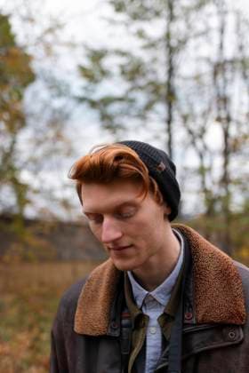 Creative Highlights Symbolfotos man with ginger hair is seen wearing a beanie and a warm jacket Montreal, Quebec, Canada CR_ARUI24092711-1549185-01 ,model released, Symbolfoto