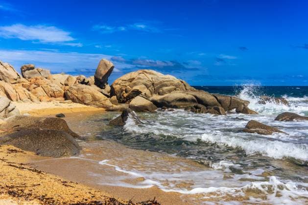 Creative Highlights World Rugged Beauty: Waves Crashing on Sardinia?s Rocky Shores Villasimius, Sardegna, Italy R_FAFA240927-1549569-01