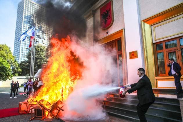 September 30, 2024, Tirana, Albania: Members of opposition Democratic party of Albania burn chairs at the entrance of parliament as saying that their chairs belong to the citizens . Tirana Albania - ZUMAb266 20240930_zip_b266_024 Copyright: xArmandoxBabanix