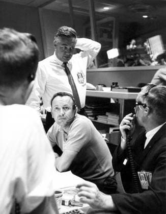 RECORD DATE NOT STATED CAPE CANAVERAL, Fla. - Inside Mercury Mission Control, Walter C. Williams standing, associate director for Project Mercury operations, and Christopher Kraft seated, left, flight director, work in flight control as the decision is made to have Mercury astronaut Gordon Cooper aboard his spacecraft, Faith 7, go the full 22 orbits. The launch took place on May 15, 1963. The Mercury Mission Control Center in Florida played a key role in the United States early spaceflight program. Located at Cape Canaveral Air Force Station, the original part of the building was constructed between 1956 and 1958, with additions in 1959 and 1963. The facility officially was transferred to NASA on Dec. 26, 1963, and served as mission control during all the Projec Copyright: xpiemagsx piemagsnasaend23-16912 !ACHTUNG AUFNAHMEDATUM GESCHÄTZT!