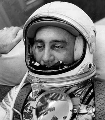 RECORD DATE NOT STATED KENNEDY SPACE CENTER, FLA. -- AWAITING ORDERS to proceed to the launching site for Project Mercury s second attempt to launch a man into space, Astronaut Virgil I. Gus Grissom relaxes in a contour chair in the Personal Equipment Room Hangar S, Cape Canaveral, Fla. A parabolic plexiglas mirror on his chest reflects the faces of two fellow Mercury pilots Walter M. Schirra (left) and M. Scott Carpenter. The mirror, which was not included in the May 5 Shepard flight, will be used to reflect the instrument panel, bringing it into view of the pilot observer camera. MR-4, known as Liberty Bell 7, has been rescheduled for Friday, July 21. (NASA Photo Copyright: xpiemagsx piemagsnasaend23-17006 !ACHTUNG AUFNAHMEDATUM GESCHÄTZT!