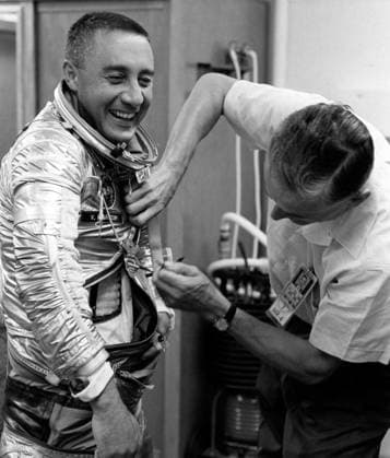 RECORD DATE NOT STATED KENNEDY SPACE CENTER, FLA. -- Project Mercury Astronaut Virgil I. Grissom, primary pilot for the Mercury-Redstone 4 manned space flight known as Liberty Bell 7, gets an assist from suit specialist Joe W. Schmidt as he prepares for the Mercury-Redstone 4 manned space flight. The flight, the second manned shot in the Mercury program, was postponed because of bad weather in the launch area. (NASA Photo Copyright: xpiemagsx piemagsnasaend23-17007 !ACHTUNG AUFNAHMEDATUM GESCHÄTZT!