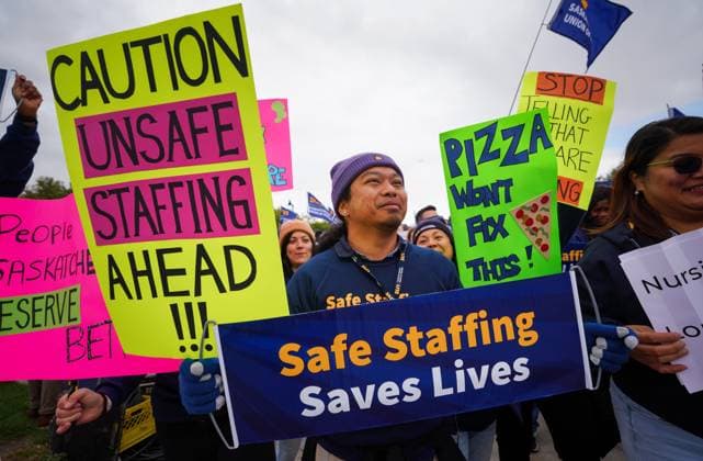 October 3, 2024, Regina, Sk, Canada: People hold signs while gathering outside of the Saskatchewan Legislative Building during a rally organized by Saskatchewan Union of Nurses in Regina, on Thursday, October 3, 2024. Regina Canada  - ZUMAc35_ 20241003_zaf_c35_118 Copyright: xHeywoodxYux