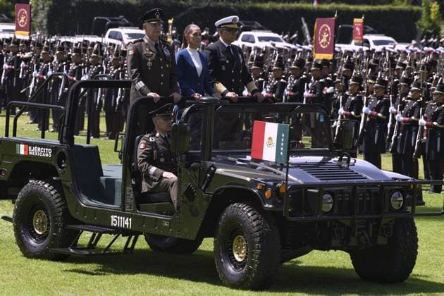 October 3, 2024, Mexico, Mexico, USA: Mexico s President Claudia Sheinbaum (C) flanked by Mexico s Defense Minister Ricardo Trevilla Trejo (L) and Secretary of the Navy Raymundo Pedro Morales Angeles (R) during the military inauguration ceremony of Claudia Sheinbaum as Supreme Commander-in-Chief of the Mexican Armed Forces, at the Campo Marte Military Camp, in Mexico City, Mexico on October 03, 2024. PRESIDENCIA POOL PI Mexico USA - ZUMAp124 20241003_zaa_p124_035 Copyright: xPresidenciax