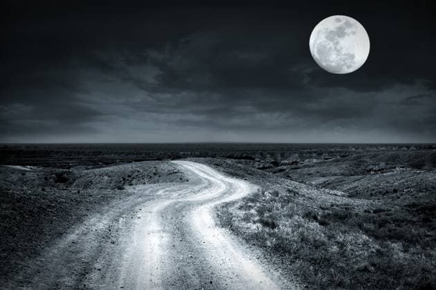 Empty rural road at full moon night Empty rural road going through prairie at full moon night with dramatic cloudy sky Copyright: xZoonar.com @xImxPerfectxLazybonesx 6027690