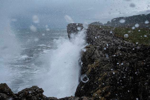 Large winter waves crash over sea cliffs at Buelna, Asturias, Spain Spain, Buelna R_XCPU241007-1554600-01