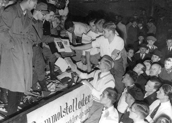 GERMANY BERLIN 1933-05-10 Orig. caption... DIE BÜCHERVERBRENNUNG AUF DEM OPERNPLATZ IN BERLIN. Abladen der undeutschen Bücher, die von Studenten gesamlet wurden und nun auf dem Opernplatz zu einem Scheiterhaufen aufgepelt werden. Reich Minister Dr. Goebbels spoke during the burning of books for the Studentenschaft. 10.5.33. Berlin Germany sp_sw x5600x *** GERMANY BERLIN 1933 05 10 Orig caption DIE BÜCHERVERBRENNUNG AUF DEM OPERNPLATZ IN BERLIN Unloading of non-German books collected by students and now piled up on the Opernplatz to form a pyre Reich Minister Dr Goebbels spoke during the burning of books for the Studentenschaft 10 5 33 Berlin Germany sp sw x5600x  Copyright: xKeystonexViewxCompany SVTx COLLECTION FOR BOOK BIRE