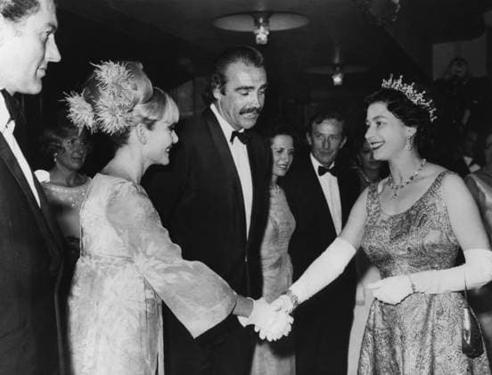 Orig. caption... MY LAST 007 ROLE- CONNERY TELLS THE QUEEN. James Bond, Secret Agent 007, met her majesty The Queen last night. The occasion was the premiere of the latest Bond thriller: You Only Live Twice, screened at the Odeon, Leicester Square, London. It was there that Bond, alias Sean Connery explained to the queen why he was resigning his 007 role. Did you feel you were where being typed? asked the queen. Yes, I m afraid I did, grinned Sean. O.P.S H.M. The Queen shaking hands with Sean Connery s wife, Diane Cilento, after meeting 007 (on right). Note Tiara Gloves Dresses Feathers Handshake Cinema Premiere persons: ELISABETH II, QUEEN OF BRITAIN;DIANE CILENTO;SEAN CONNERY sites: LONDON;BRITAIN sp_sw x5600x *** Orig caption MY LAST 0  Copyright: xx SEAN CONNERY AND QUEEN ELIZABETH