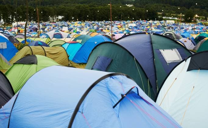 Tent, field and outdoor for festival or camping in nature, summer or forest for adventure or vacation. Event, campsite or setup for sleeping, rest or shelter in woods, trees or environment background. model released property released Copyright: xPeopleImages.comx-x 518be3c1b952fx